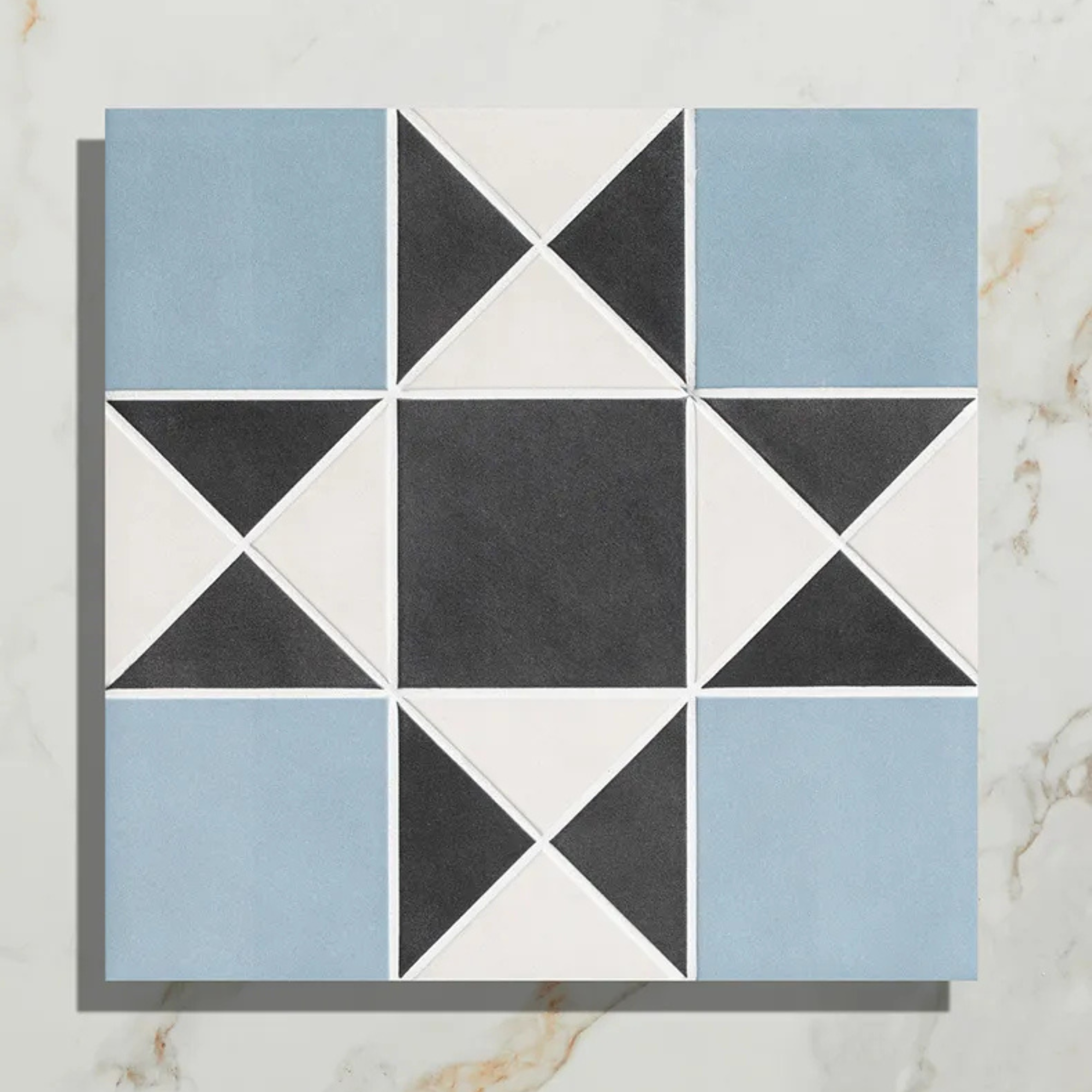 a blue and white victorian style tile 