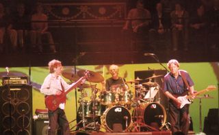 (from left) Jack Bruce, Ginger Baker, and Eric Clapton perform onstage at the Royal Albert Hall in London on May 5, 2005