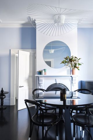 A dining room drenched in light blue