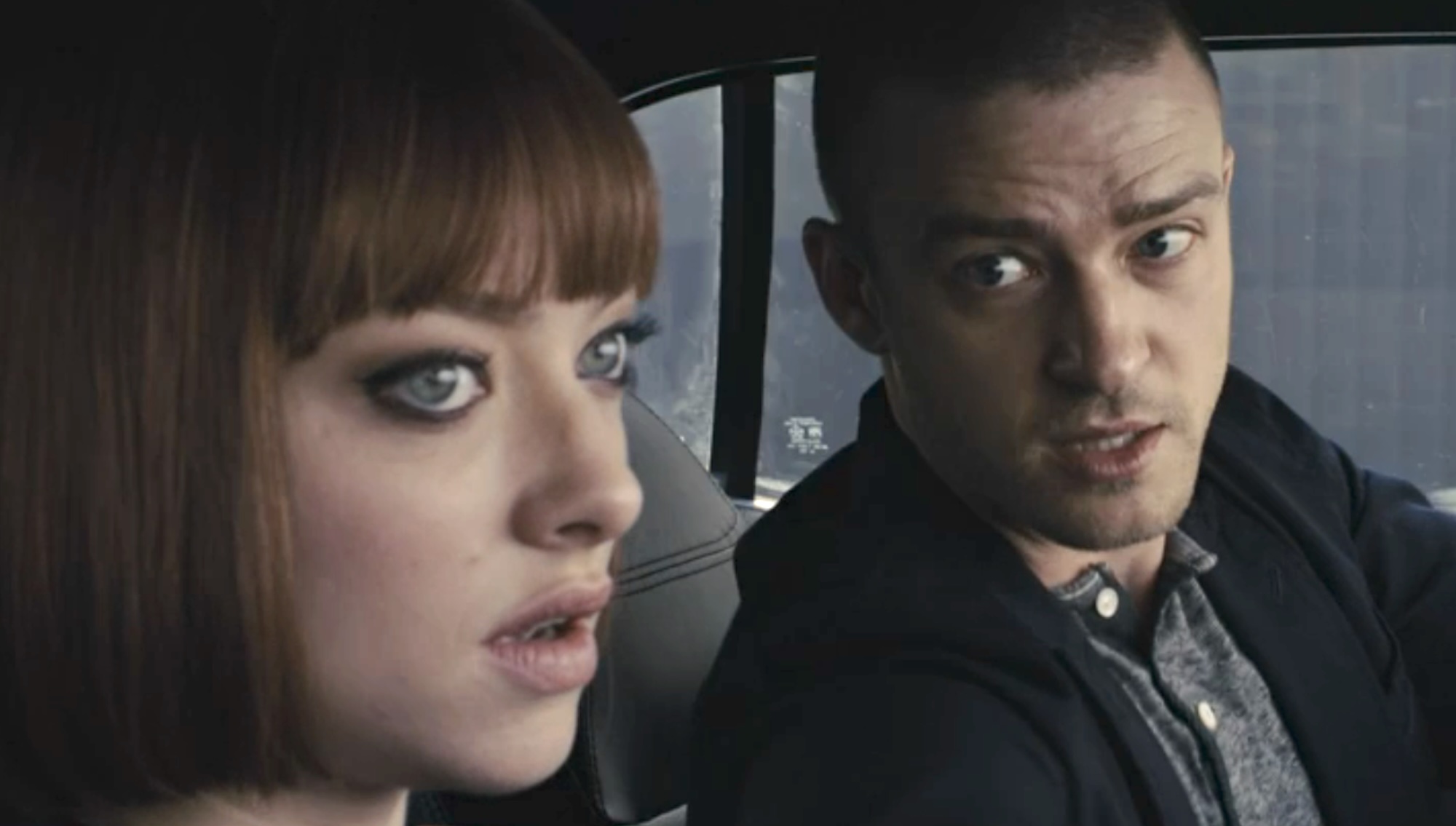 Amanda Seyfried and Justin Timberlake sitting together in the car in In Time