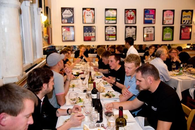 Riders and staff enjoy a Bissell team tradition of dinner at the always excellent Riviera restaurant in Santa Rosa, framed by autographed jerseys of many Euro pros.