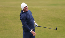 Brooks Koepka watches a shot in the air