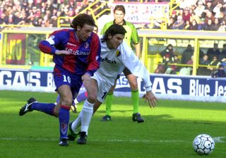 Bologna's Giuseppe Signori competes for the ball with Modena's Rubens Pasino in a Serie A match in December 2002.