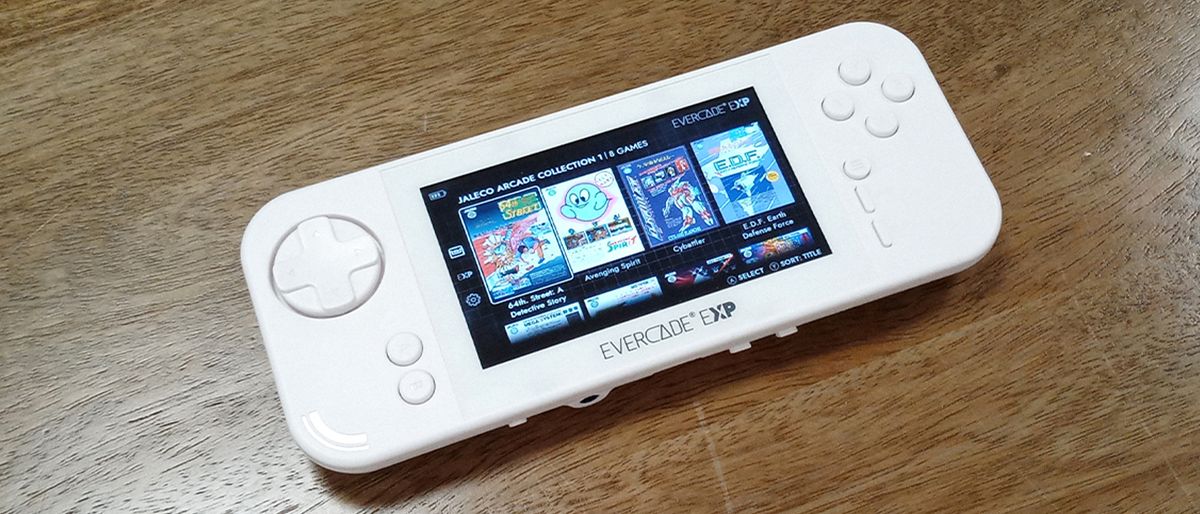 Evercade EXP review; a white handheld games console on a wooden table