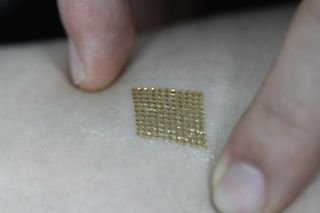 This photo shows the monitor attached on human skin.