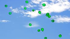 green balloons in the sky