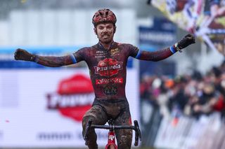 Belgian Eli Iserbyt celebrates as he crosses the finish line to win the Elite men race, at the Belgian Championships cyclocross cycling in Meulebeke on January 14, 2024. (Photo by DAVID PINTENS / Belga / AFP) / Belgium OUT