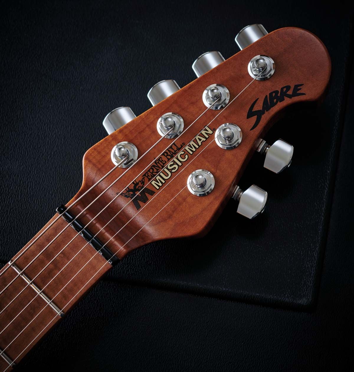 The 2020 Sabre comes with a recognisable 4 over 2 headstock whereas the original Sabres were six-in-line a la Fender. That nut is compensated to aid intonation.