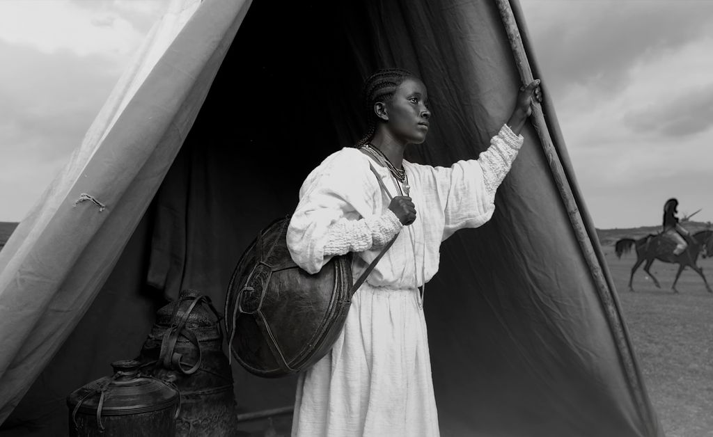 Woman in front of a tent