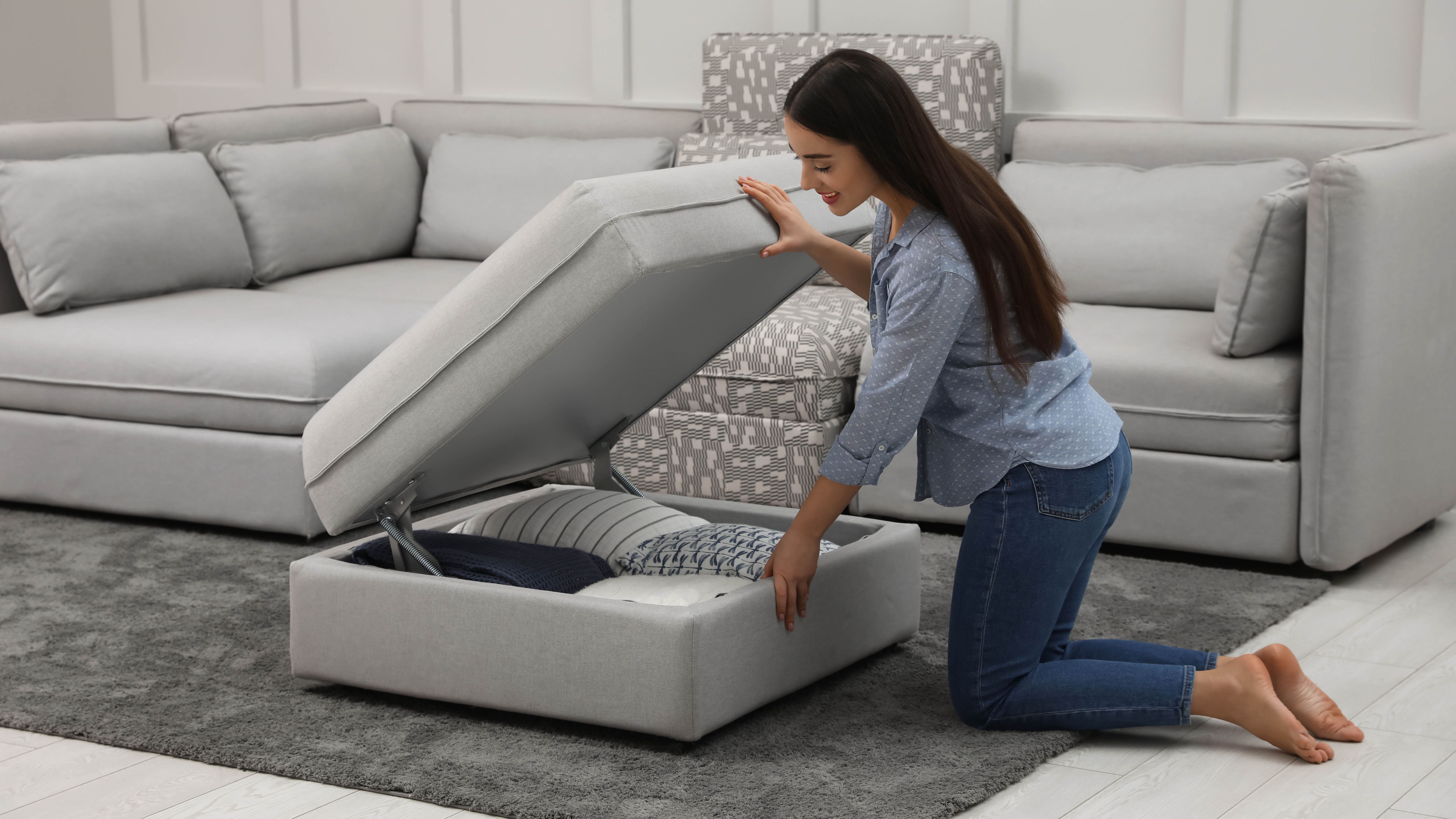 Woman opens a large storage chair