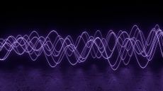 An illustration of purple waves to represent electromagnetism 