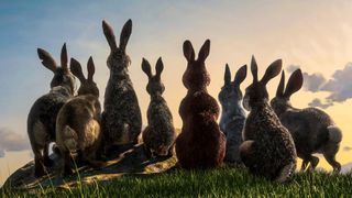 En bild från påskfilmen Den långa flykten, där gruppen kaniner sitter tillsammans på en kulle i solnedgången och blickar ut.