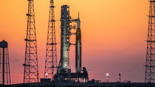 The sunrise casts a warm glow around the Artemis I Space Launch System (SLS) and Orion spacecraft at Launch Pad 39B at NASA’s Kennedy Space Center in Florida on March 21, 2022.