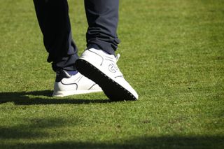 Golf shoes pictured during a golf swing