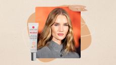 Image of Rosie Huntington-Whiteley with wavy blonde hair and wearing a grey blazer, on a beige background with a foundation swatch and Erborian's BB Creme 