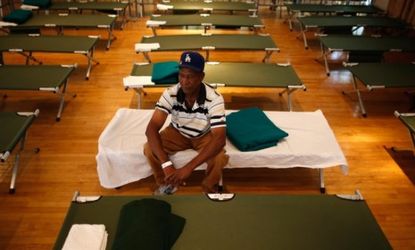 A Louisiana resident rests on his cot in a Belle Chasse hurricane shelter Aug. 27