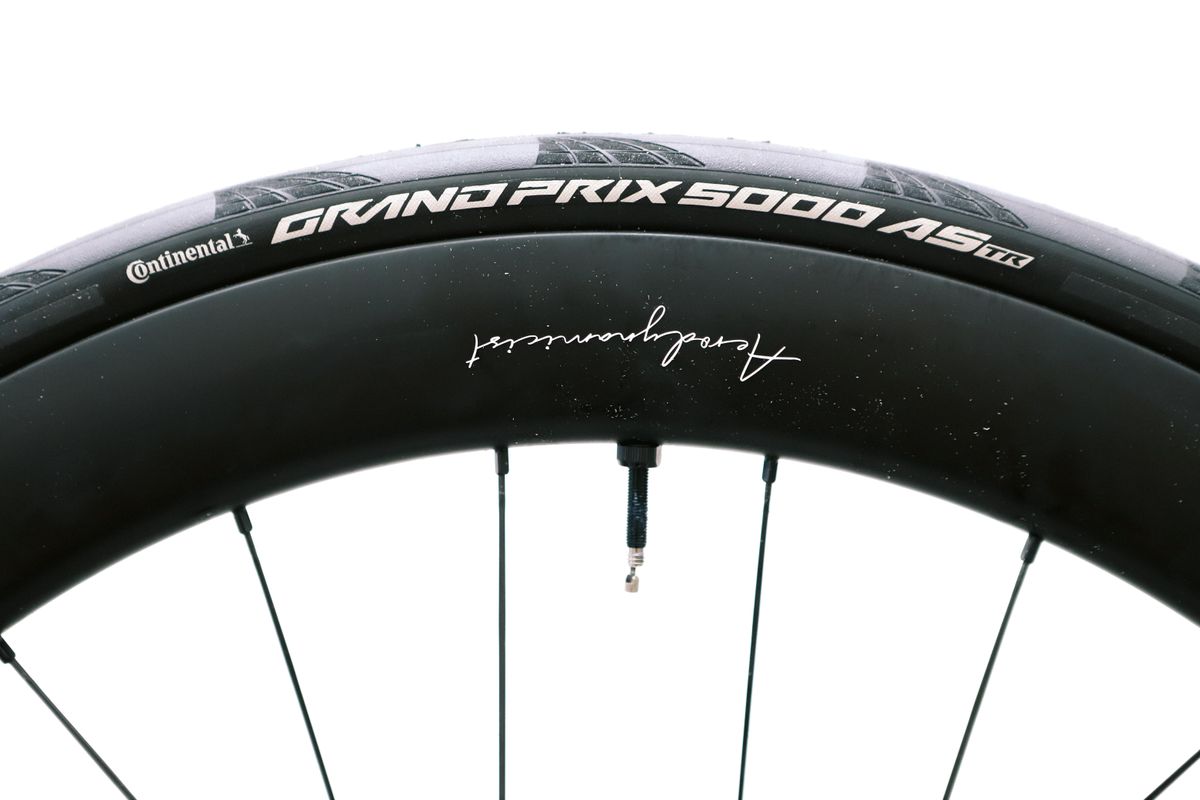 a close up of a black road bike tyre