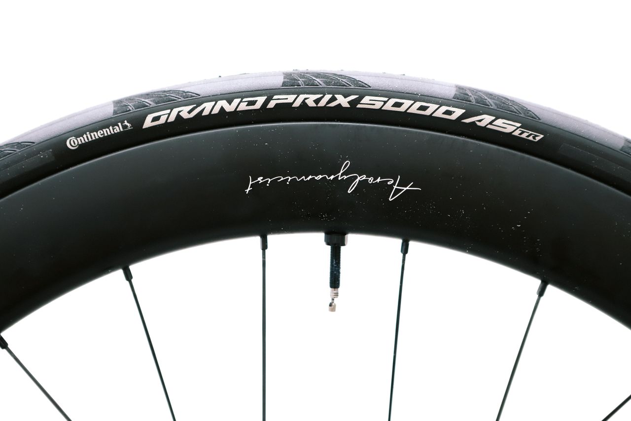 a close up of a black road bike tyre