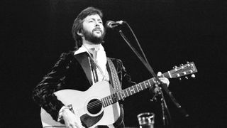Eric Clapton playing his 1974 Martin 000-28 acoustic guitar onstage in 1977 at the Hammersmith Odeon, London