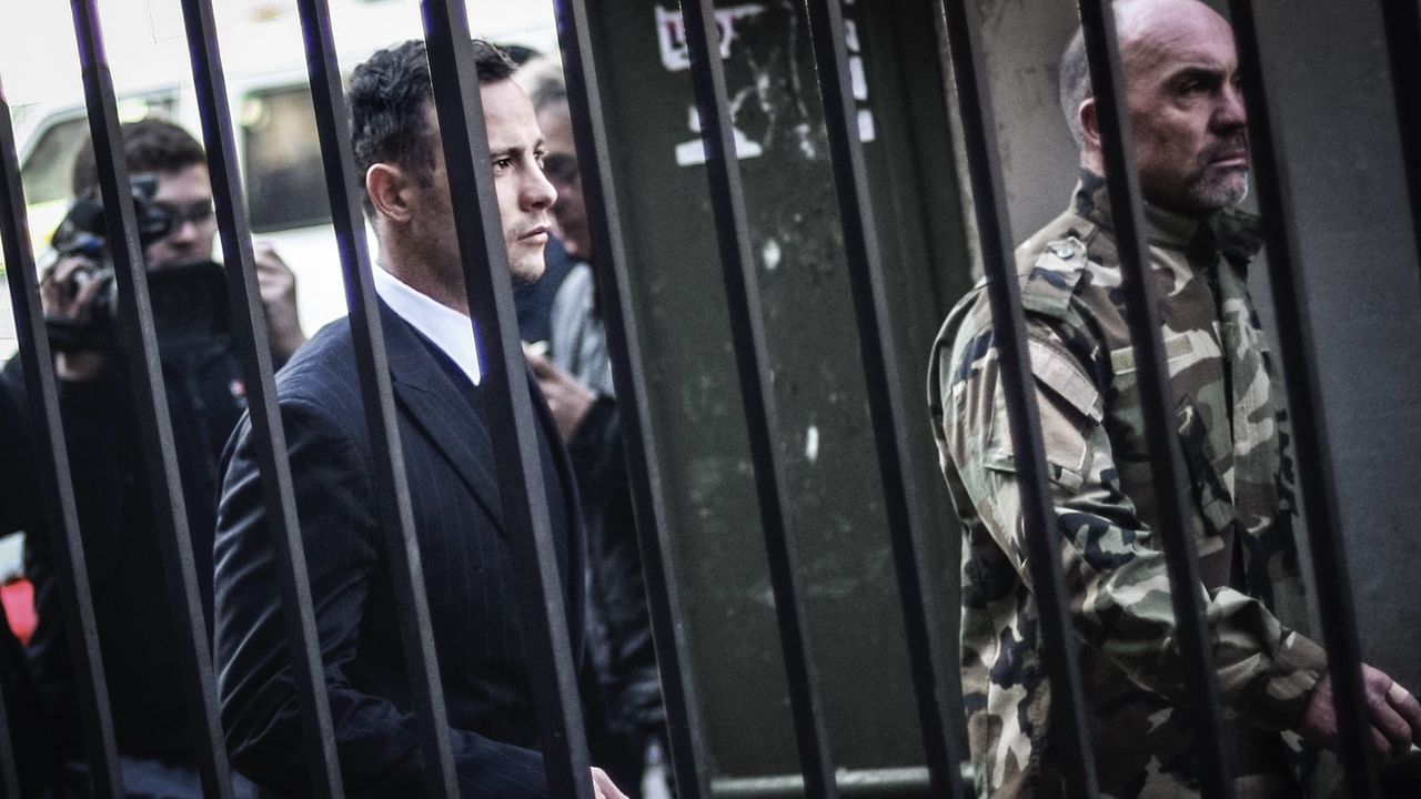 Oscar Pistorius being walked into his trial in 2016