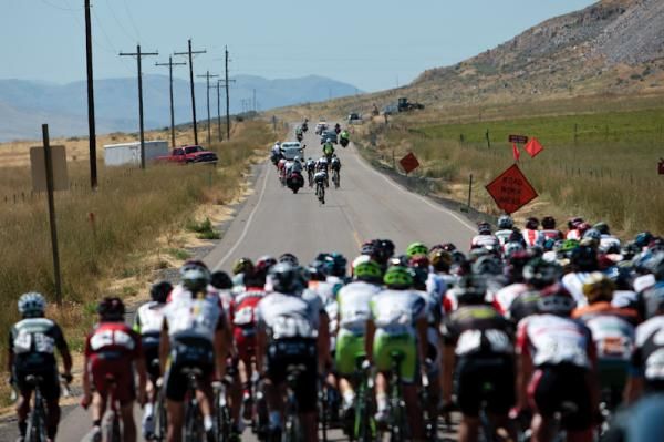 A group begins to get up the road at the beginning of the day.