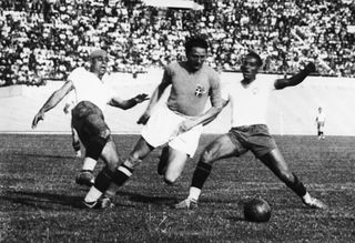 Silvio Piola (centre) in action for Italy against Brazil at the 1938 World Cup.