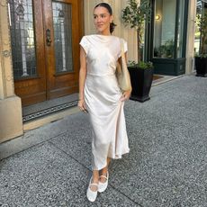 Emma Leger a white silk dress