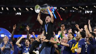 BUDAPEST, HUNGARY - MAY 30: Luis Enrique head coach of PSG lifts the Champions League trophy following the UEFA Champions League Final 2026 match between Paris Saint-Germain and Arsenal FC at Puskas Arena on May 30, 2026 in Budapest, Hungary. (Photo by Jose Hernandez/Anadolu via Getty Images)