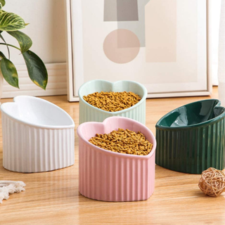 Four heart shaped bowls for cats