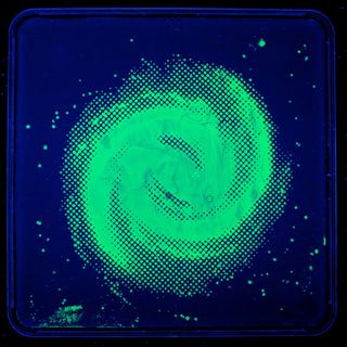 Artist and former microbiologist Zachary Copfer uses bacteria, given genes that make them fluorescent, to create images, such as this one of the Milky Way Galaxy. These pieces were inspired by Carl Sagan's term "star stuff," which refers to the concept th