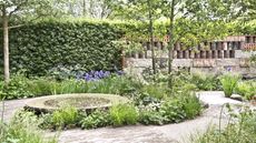 A show garden with spring bulbs and green foliage