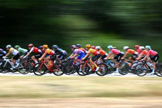 The peloton racing at the Tour de France Femmes
