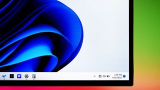 Close up of the Windows 11 Taskbar on a Dell monitor.