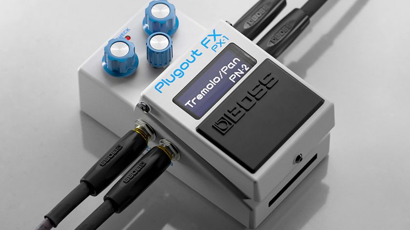 The Boss PX-1 Plugout FX is a white compact series Boss pedal with three blue dials with silver inserts, and has eight assignable presets so that it can be any one of 16 classic pedals.