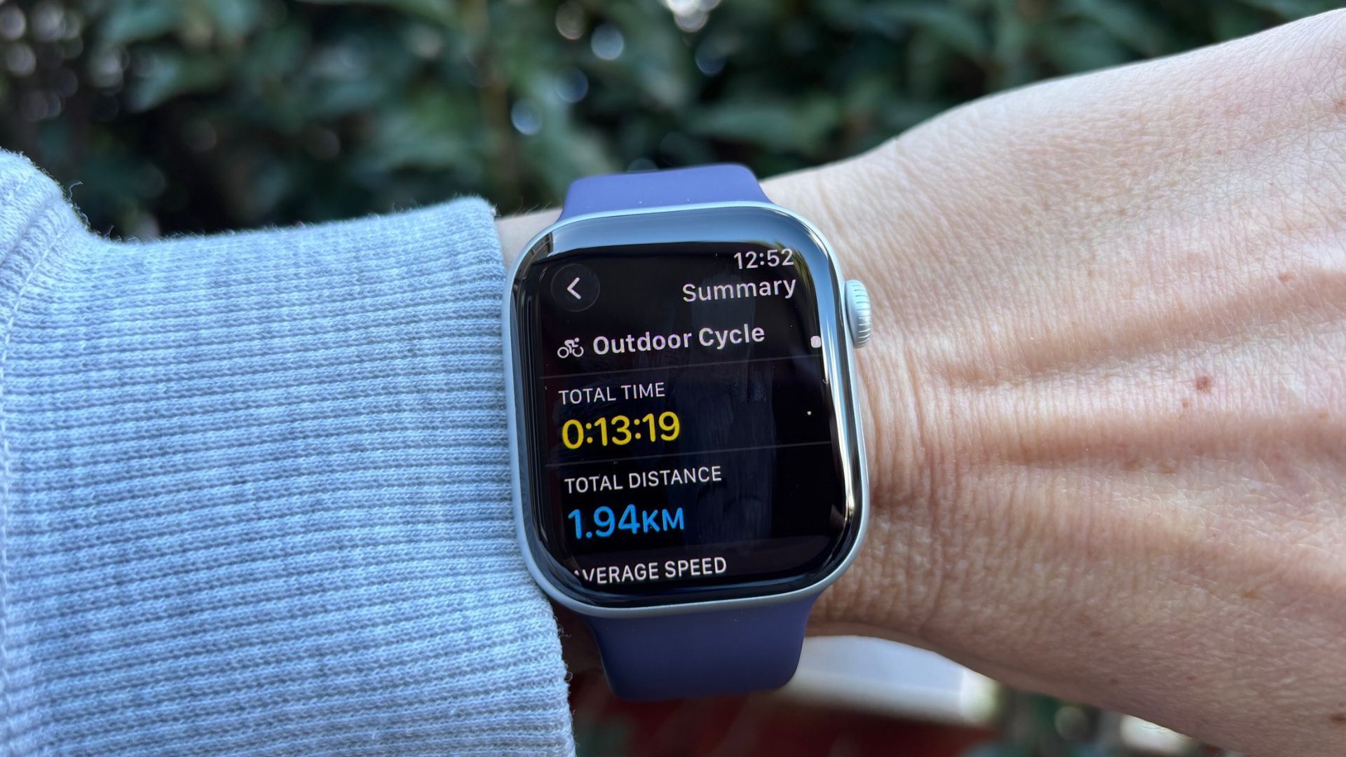 The image shows an Apple Watch series 11 on a wrist, displaying the cycle activity