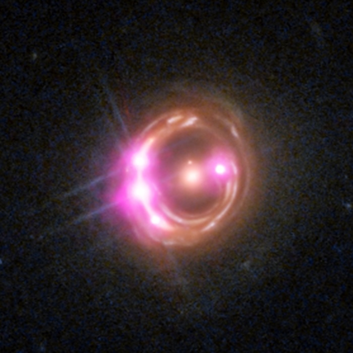 A pink, red, green, and blue swirl against a black background