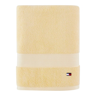 A yellow Tommy Hilfiger bath towel