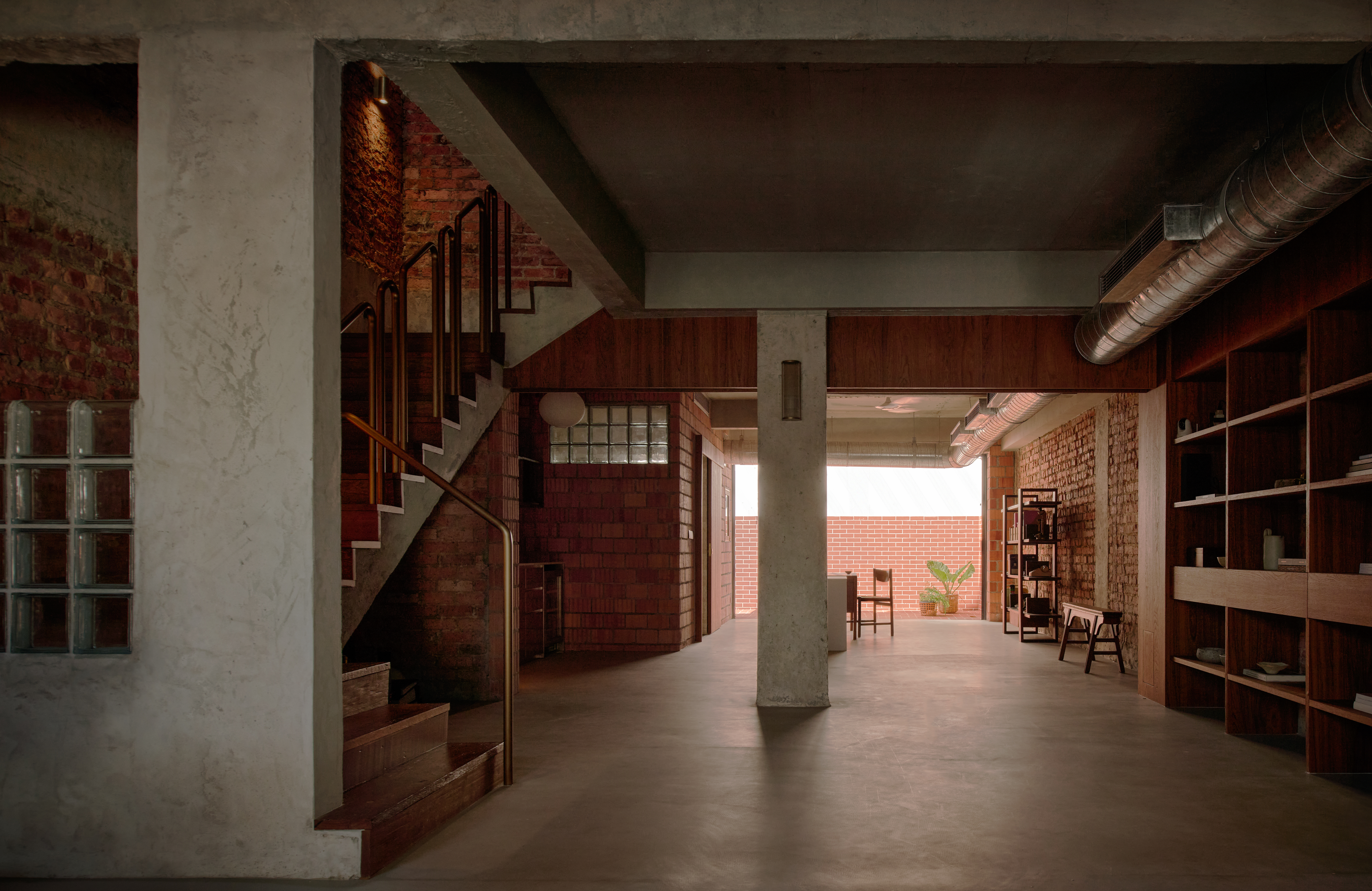 'My last home' by L Architects, a raw interior space of exposed brown brick and wood detailing