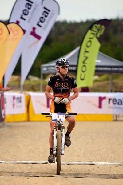 Jenni King crosses the line in 1st place.