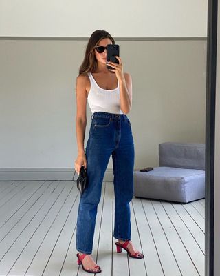 @smythsisters wearing jeans and red heels