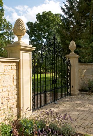 driveway with an ornate gate