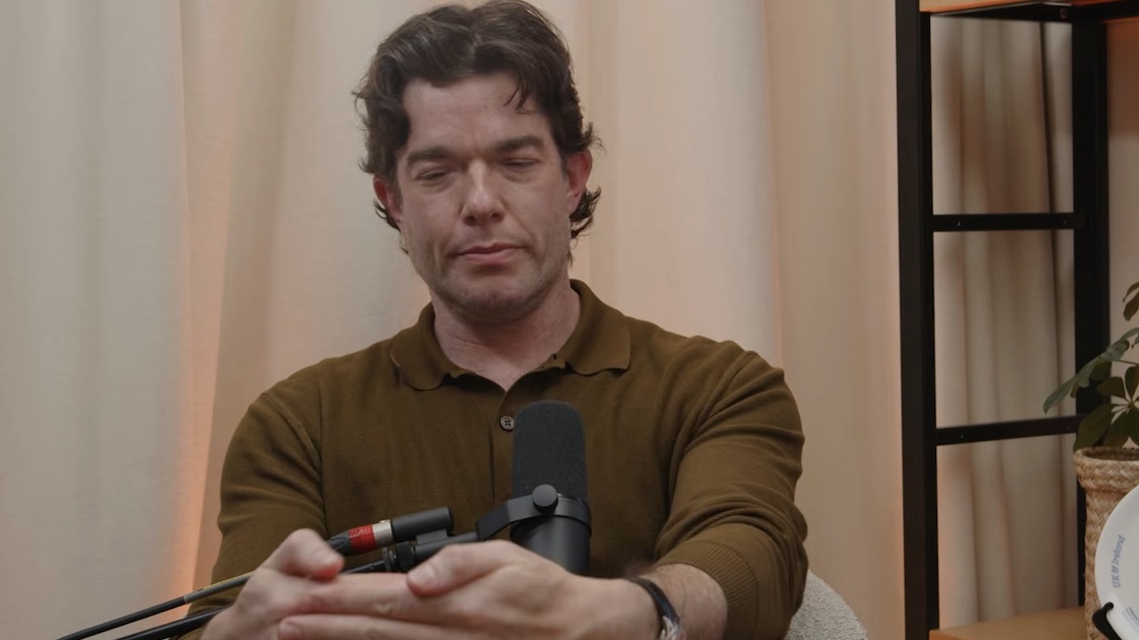 John Mulaney holding hands together in front of him on Off Menu with Ed Gamble and James Acaster