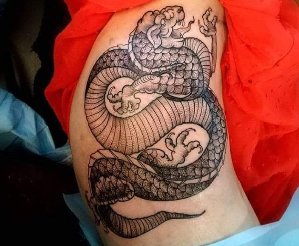 Etchwork dragon tattoo