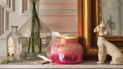 A pearly pink candle jar