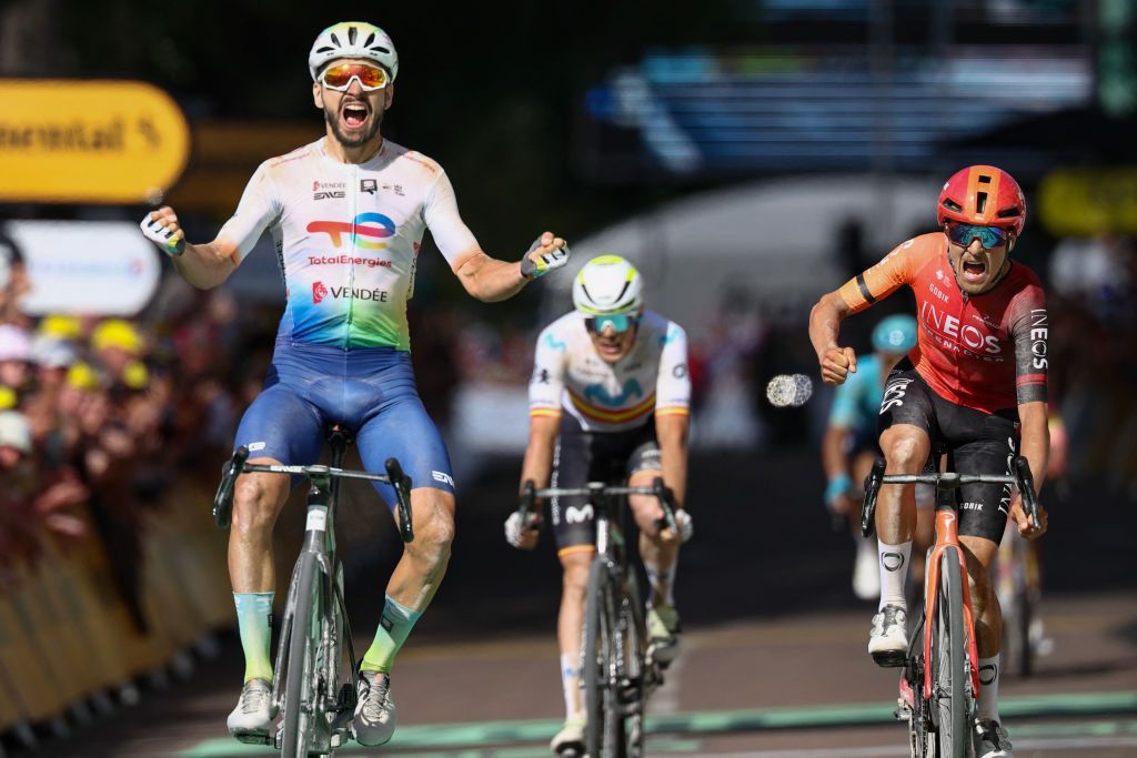 TotalEnergies team's French rider Anthony Turgis cycles to the finish line to win ahead of second-placed INEOS Grenadiers team's British rider Tom Pidcock (R) during the 9th stage of the 111th edition of the Tour de France cycling race, 199km stage departing and finishing in Troyes, on July 7, 2024. (Photo by Anne-Christine POUJOULAT / AFP)