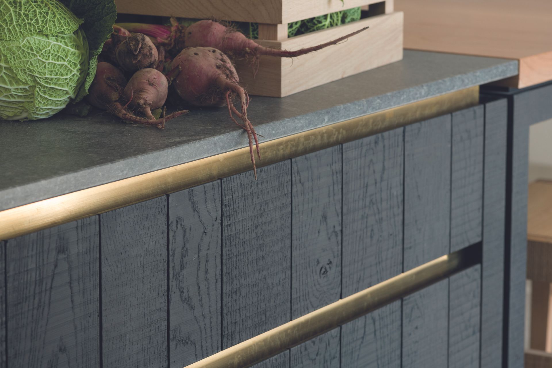 A kitchen with metallic detailing