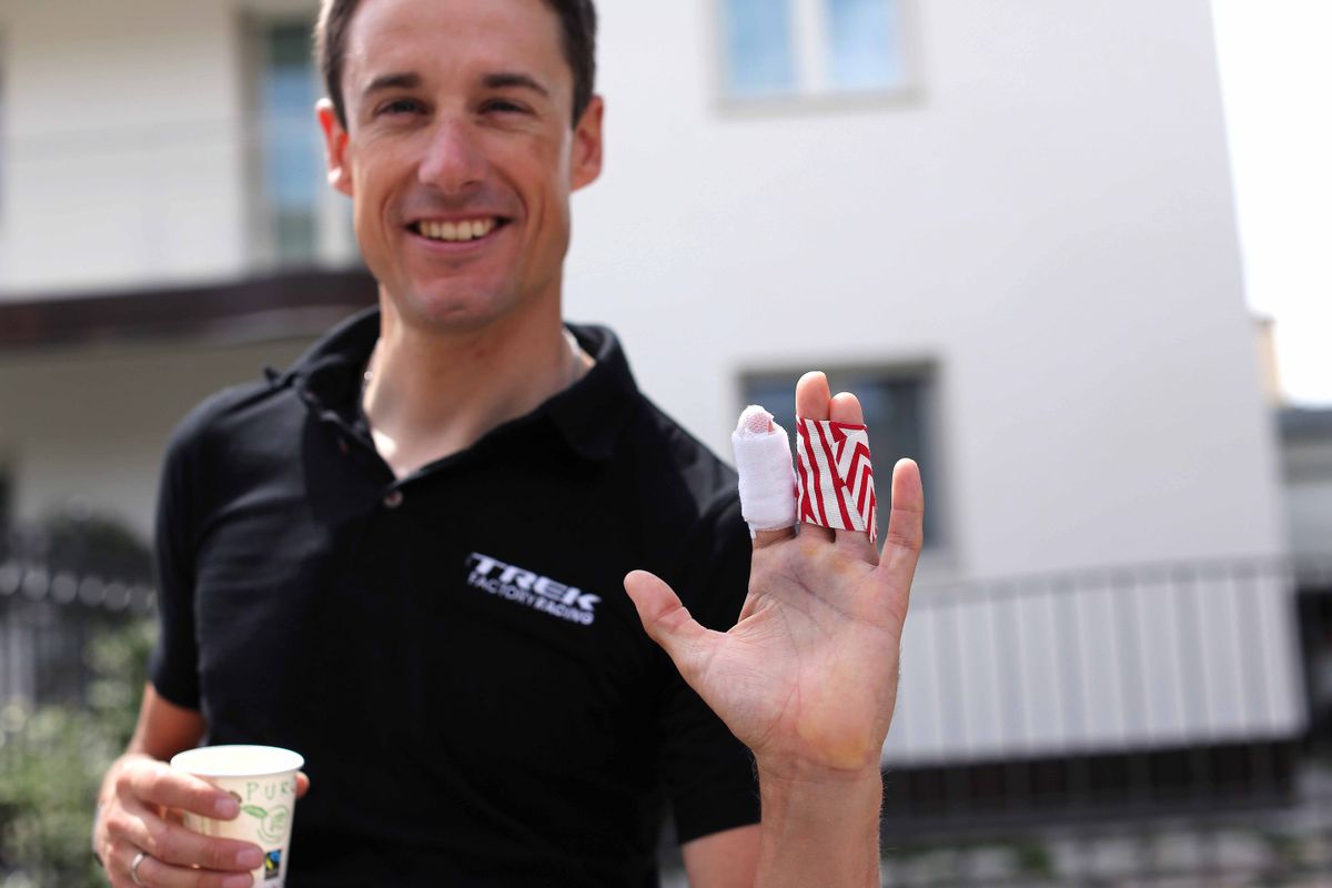 Kristof Vandewalle shows off his bandaged broken finger sustained in the time trial