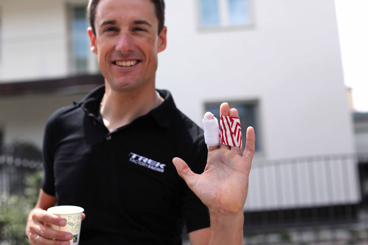 Kristof Vandewalle shows off his bandaged broken finger sustained in the time trial
