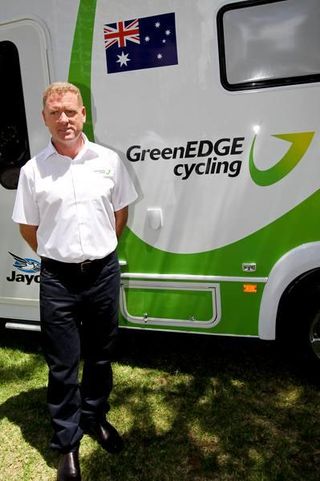Shayne Bannan posses in front of the Greenedge Cycling van.