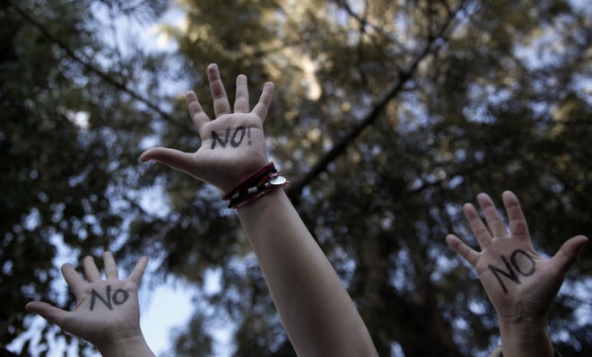 Protesters demonstrate during an anti-bailout rally outside Cyprus' parliament in Nicosia on March 18.